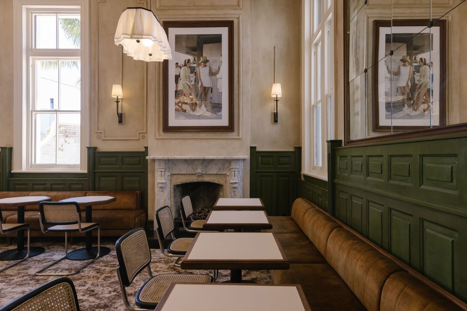Hotel Ponsonby dining room with fireplace and green panelling